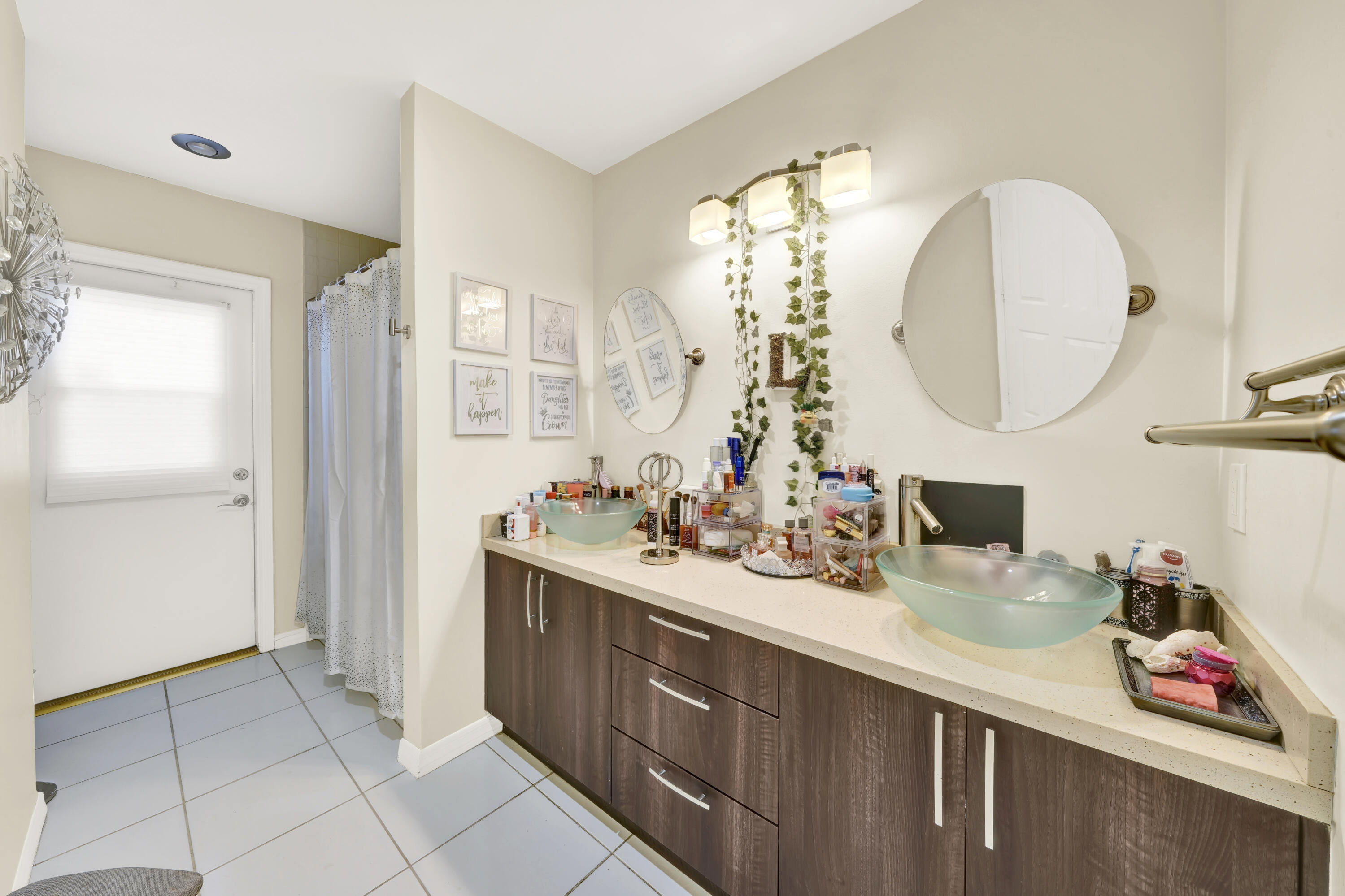 20513 Sausalito Drive Boca Raton, FL 33498 - Photo 22 of 39 a bathroom with a sink and a mirror