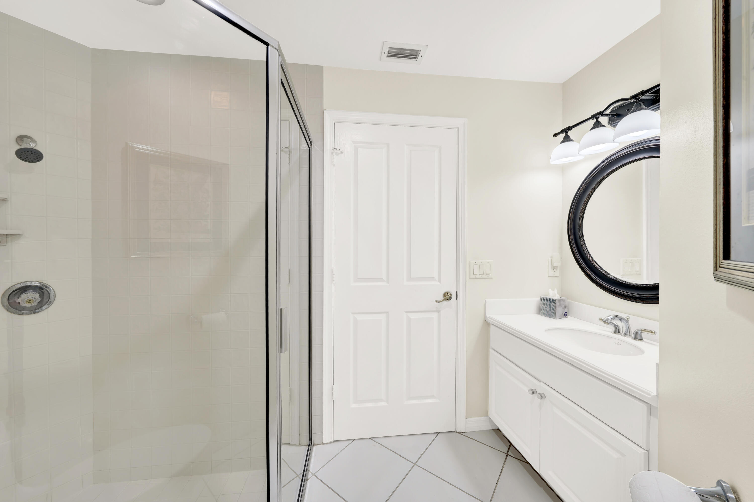 20513 Sausalito Drive Boca Raton, FL 33498 - Photo 23 of 39 a bathroom with a sink and a mirror