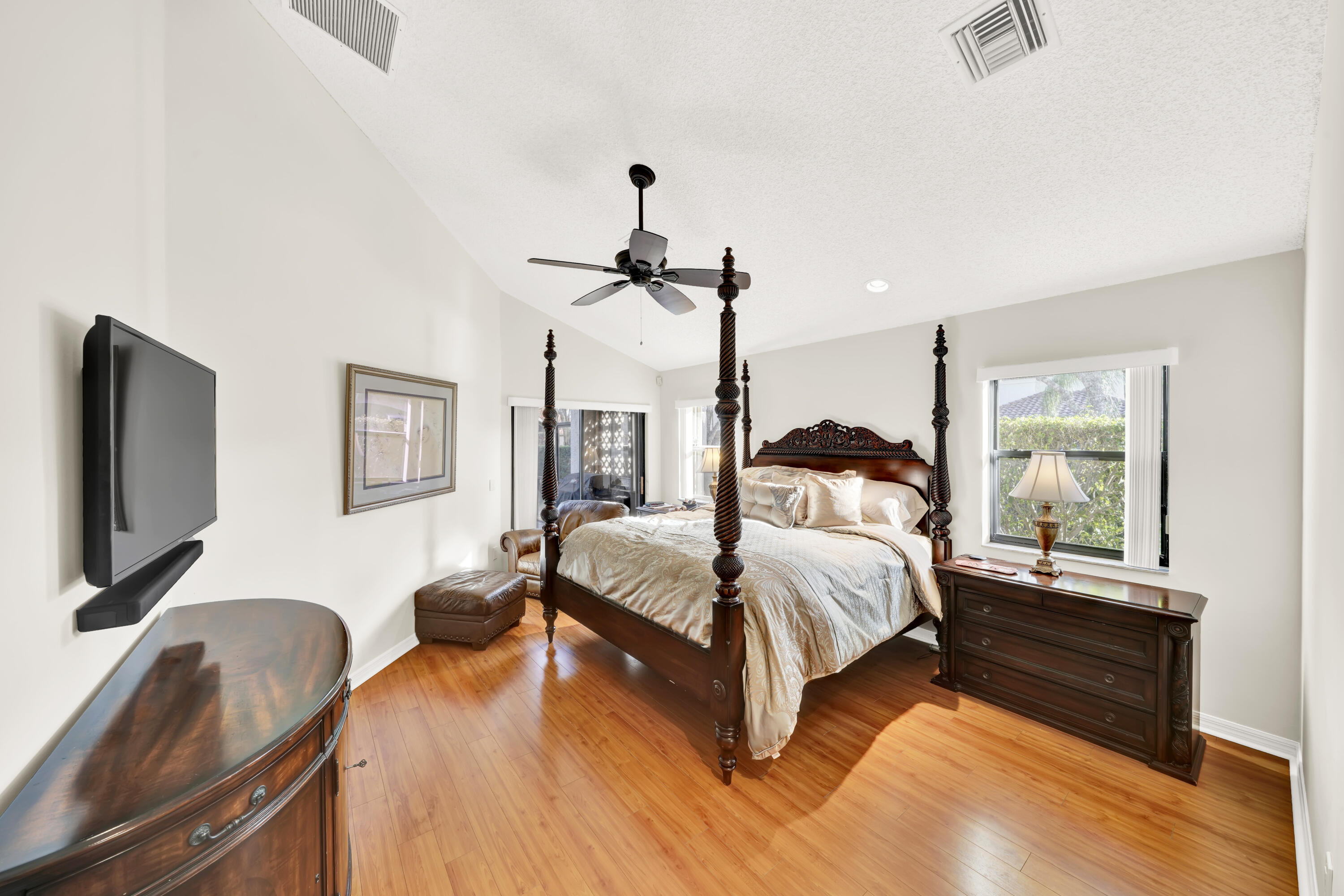 20513 Sausalito Drive Boca Raton, FL 33498 - Photo 28 of 39 a bedroom with a bed window and a flat screen tv