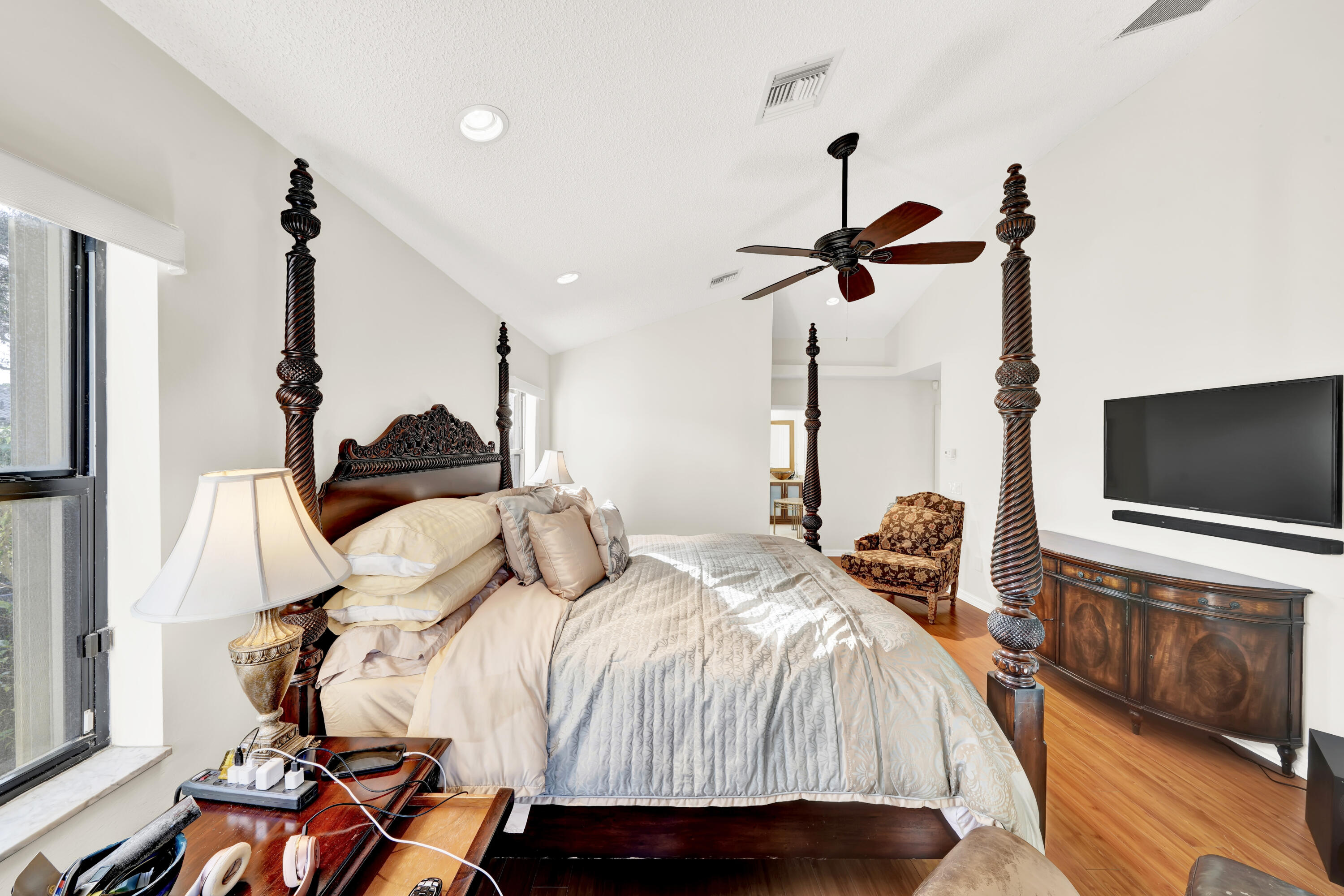 20513 Sausalito Drive Boca Raton, FL 33498 - Photo 30 of 39 a bedroom with a bed and a flat screen tv