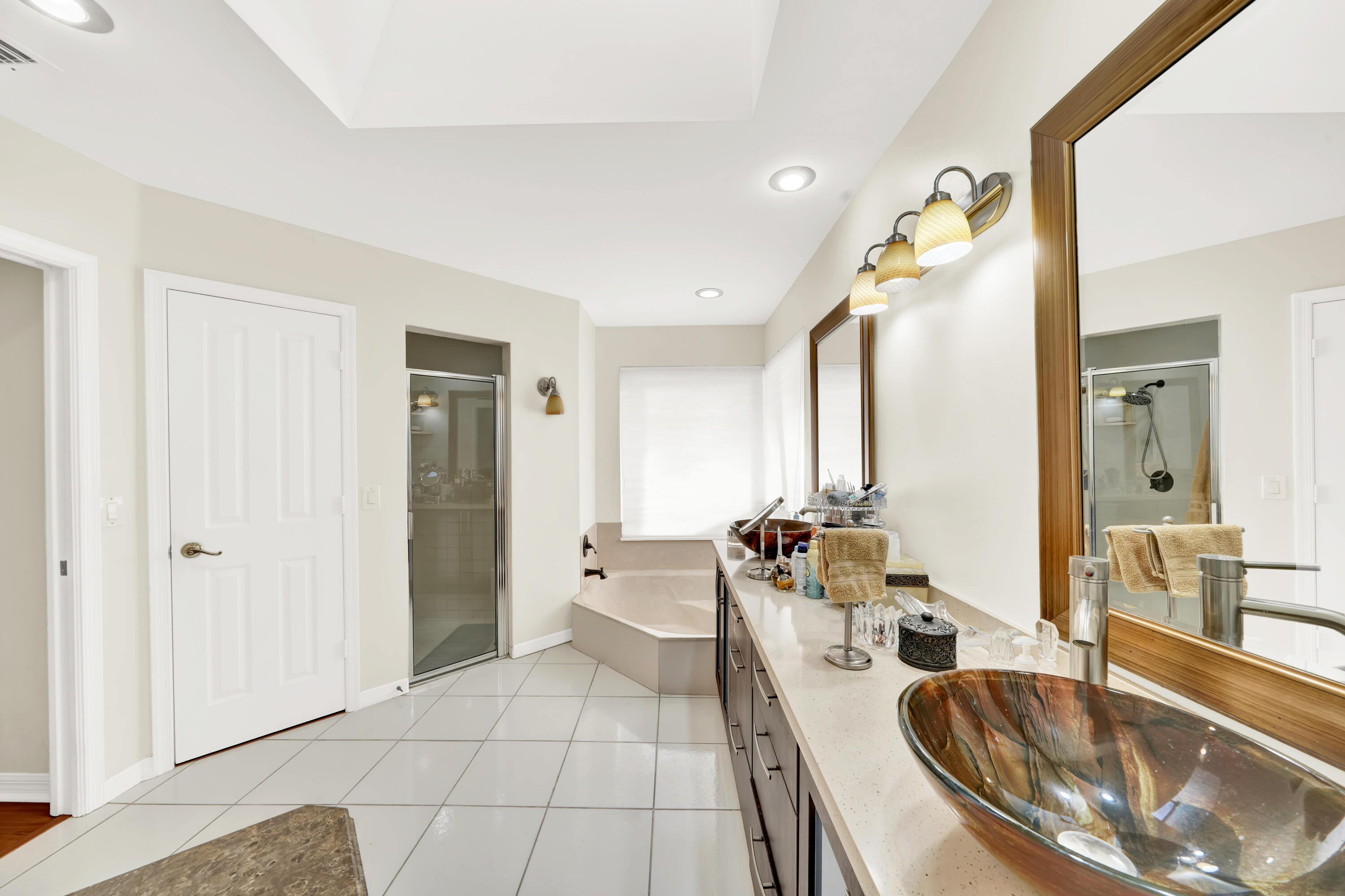 20513 Sausalito Drive Boca Raton, FL 33498 - Photo 32 of 39 a large living room with stainless steel appliances granite countertop a sink and a large mirror