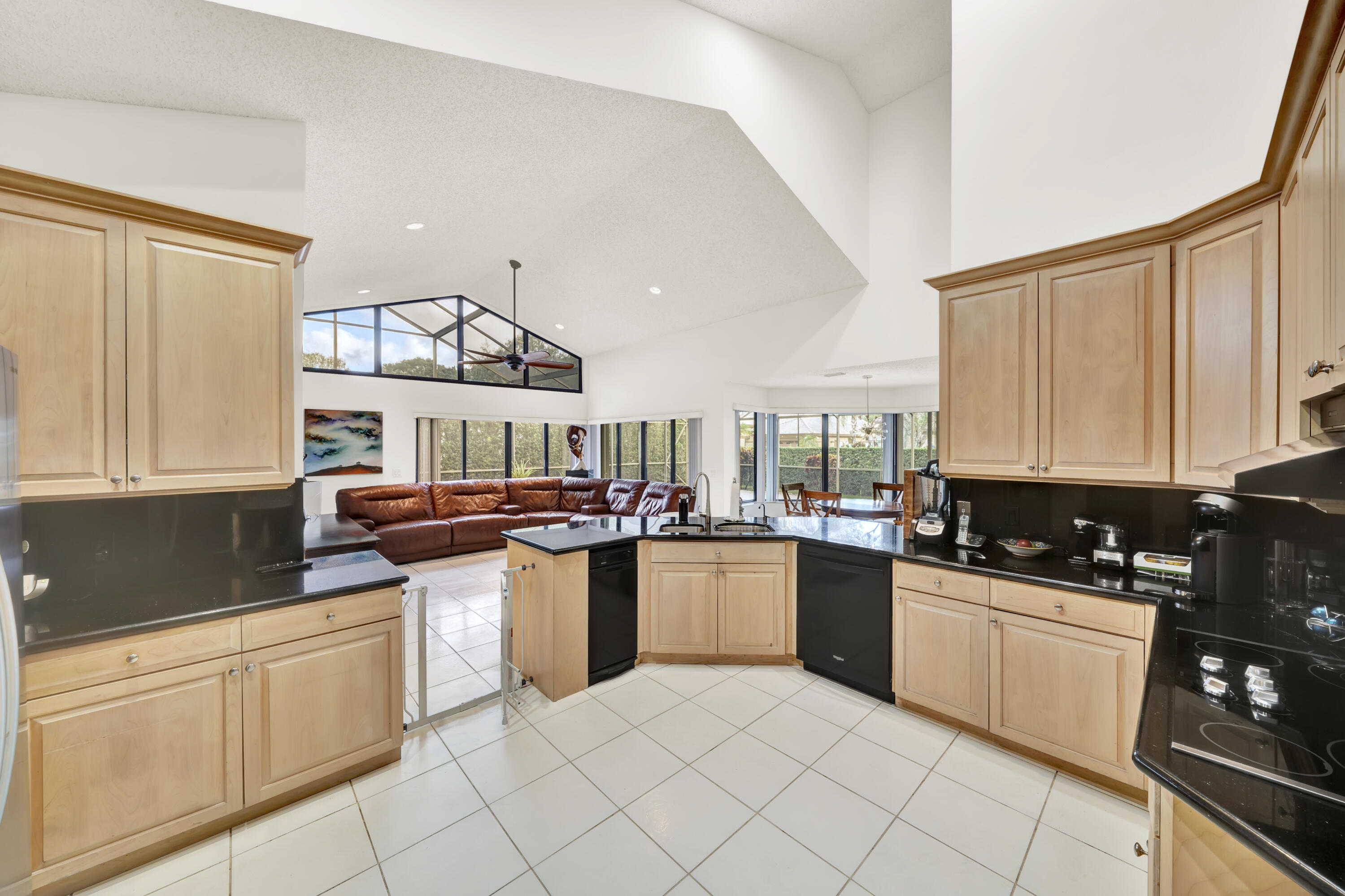 20513 Sausalito Drive Boca Raton, FL 33498 - Photo 7 of 39 a kitchen with a sink a stove and cabinets