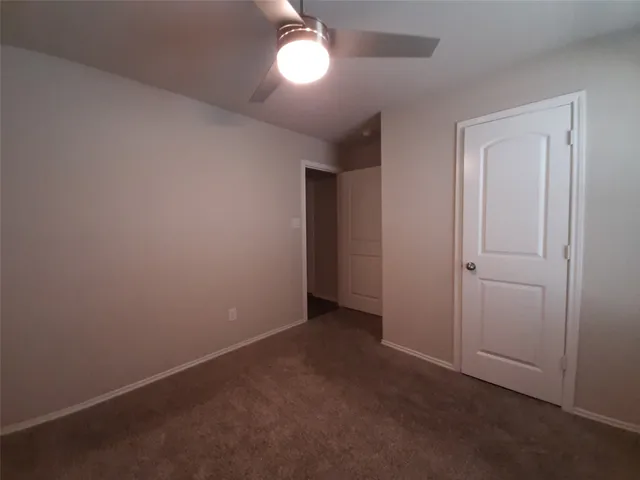 an empty room with a bathroom