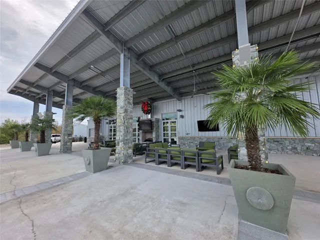 a view of a backyard patio and fire pit