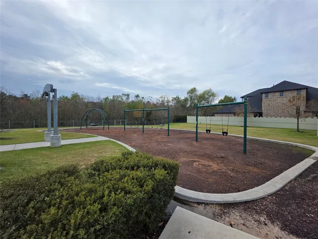 a view of a playground with basketball court