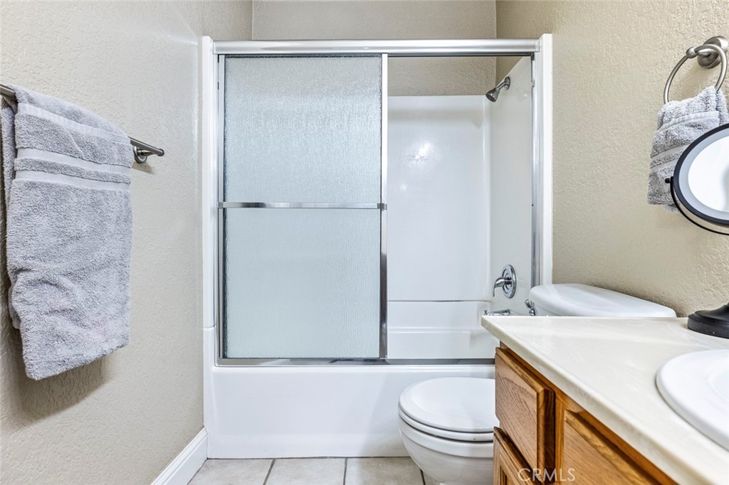 2881 Huntington Boulevard, Unit 137 Fresno, CA 93721 - Photo 21 of 30 a bathroom with a sink and a mirror