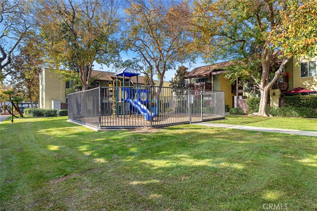 2881 Huntington Boulevard, Unit 137 Fresno, CA 93721 - Photo 24 of 30 a view of a park with a slide