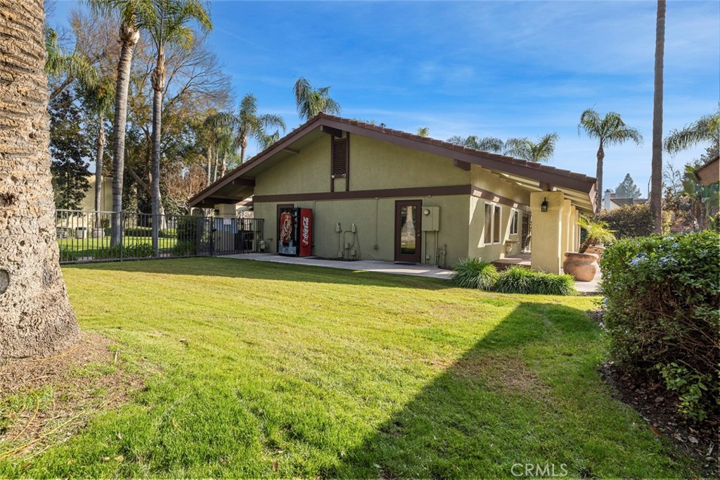 2881 Huntington Boulevard, Unit 137 Fresno, CA 93721 - Photo 27 of 30 a front view of a house with a yard