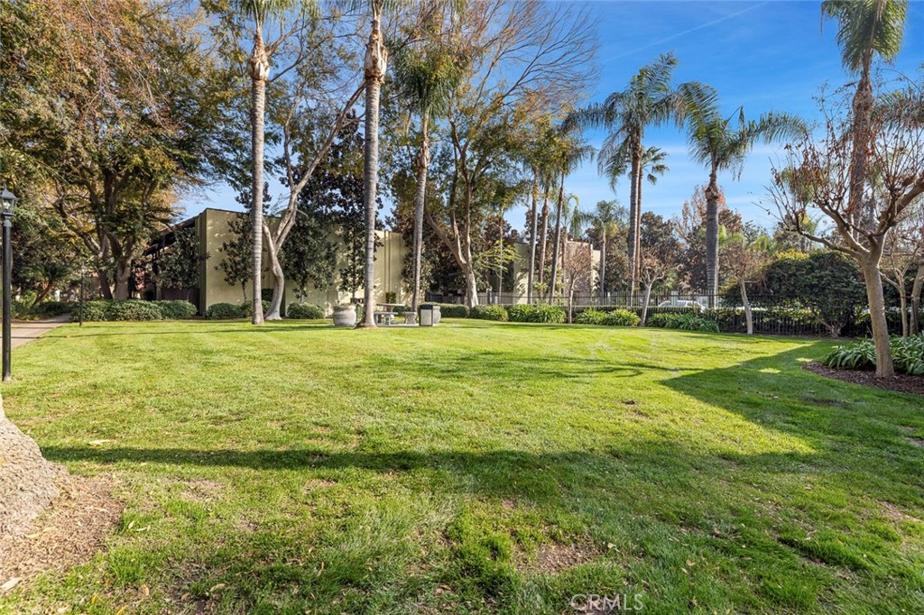 2881 Huntington Boulevard, Unit 137 Fresno, CA 93721 - Photo 28 of 30 a building with trees in the background