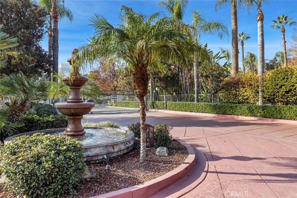 2881 Huntington Boulevard, Unit 137 Fresno, CA 93721 - Photo 29 of 30 a view of a fountain in the middle of a yard