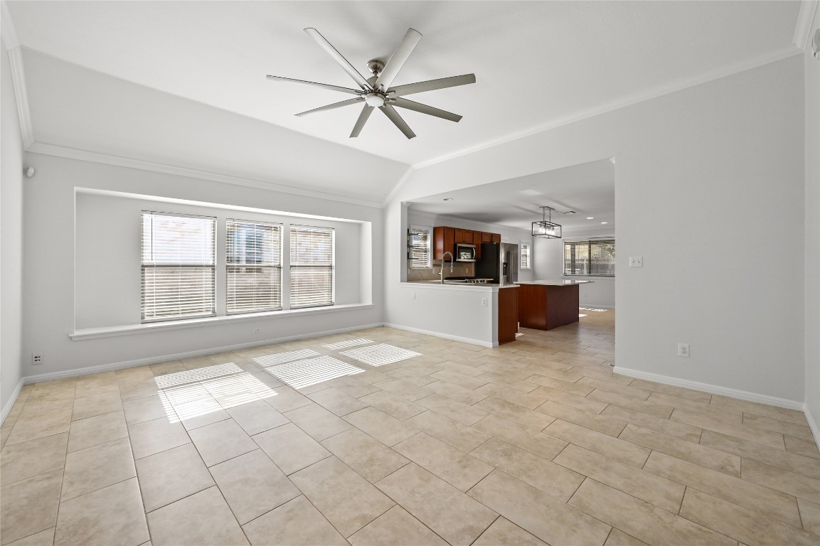 6909 Bay City Bend Austin, TX 78725 - Photo 15 of 37 a living room with a couch and ceiling fan