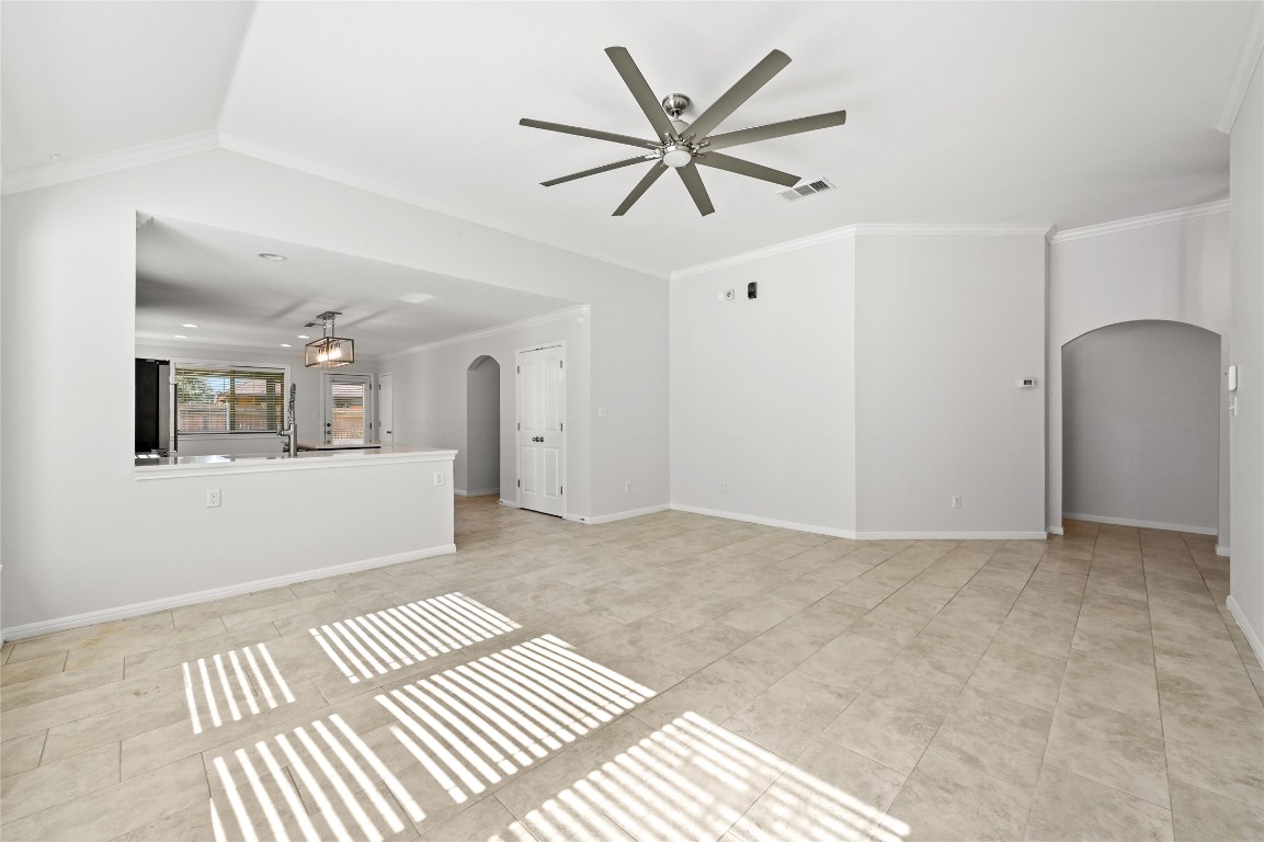 6909 Bay City Bend Austin, TX 78725 - Photo 2 of 37 a view of a big room with wooden floor and windows