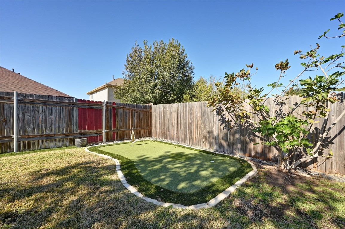 6909 Bay City Bend Austin, TX 78725 - Photo 28 of 37 a swimming pool with wooden fence