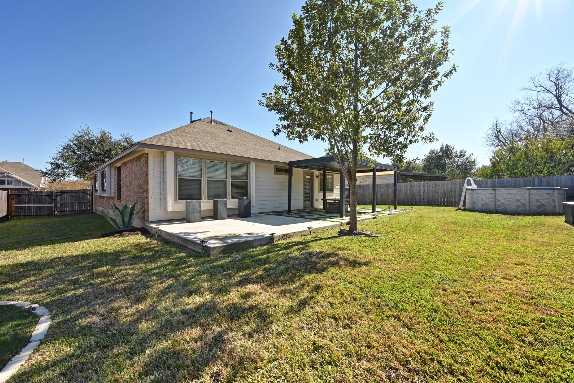 6909 Bay City Bend Austin, TX 78725 - Photo 29 of 37 a view of a house with a yard and sitting area