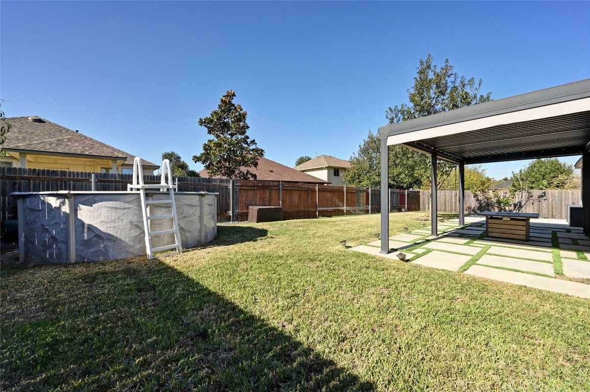 6909 Bay City Bend Austin, TX 78725 - Photo 30 of 37 a view of a house with backyard and sitting area