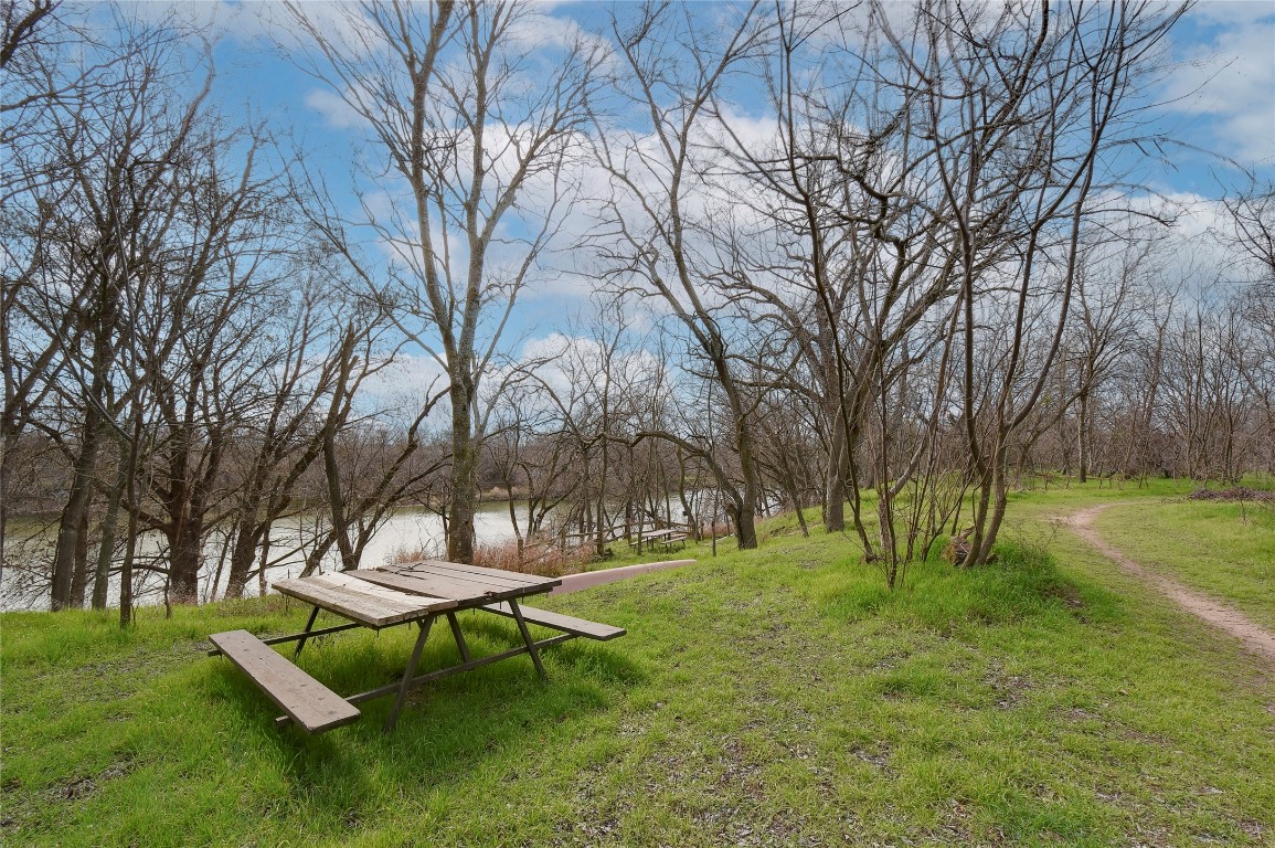 6909 Bay City Bend Austin, TX 78725 - Photo 34 of 37 a view of a park with bench and trees