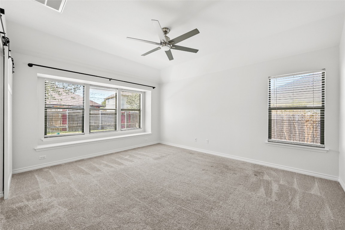 6909 Bay City Bend Austin, TX 78725 - Photo 5 of 37 a view of an empty room with a window