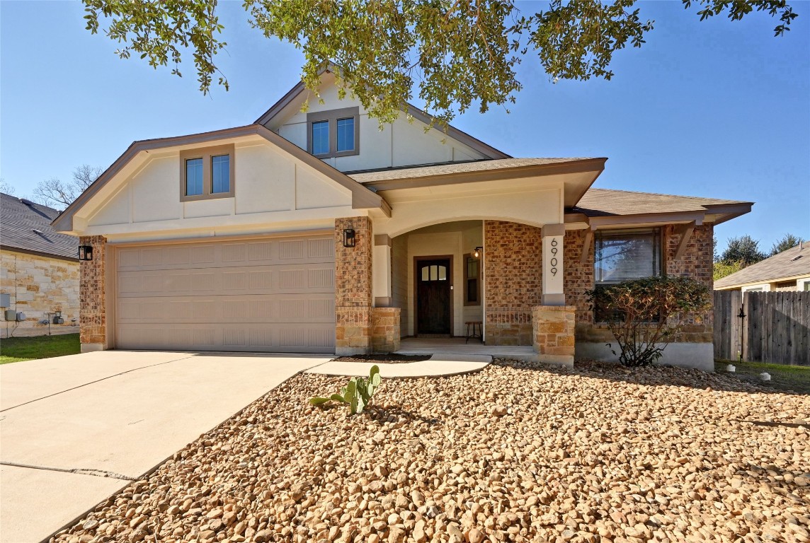 6909 Bay City Bend Austin, TX 78725 - Photo 9 of 37 a front view of a house