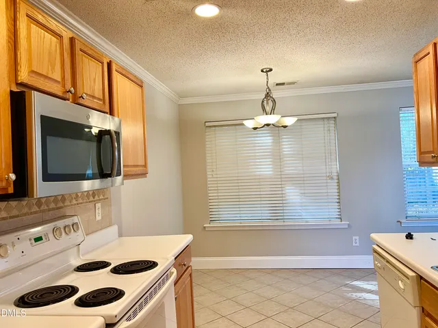 a bathroom with a sink a bath tub and a window