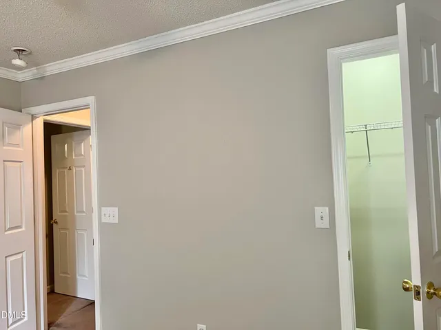 a view of a bathroom from a hallway