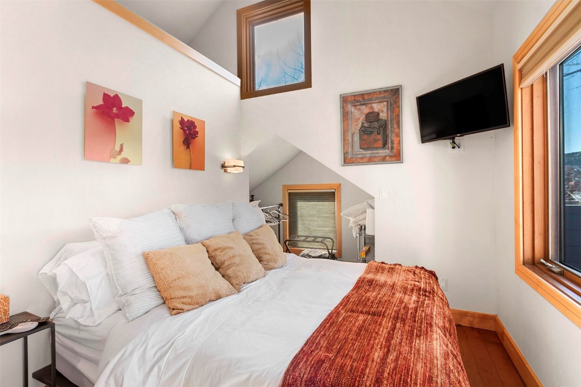 217 South Ridge Street, Unit 3 Breckenridge, CO 80424 - Photo 12 of 21 a bedroom with a bed and a flat screen tv