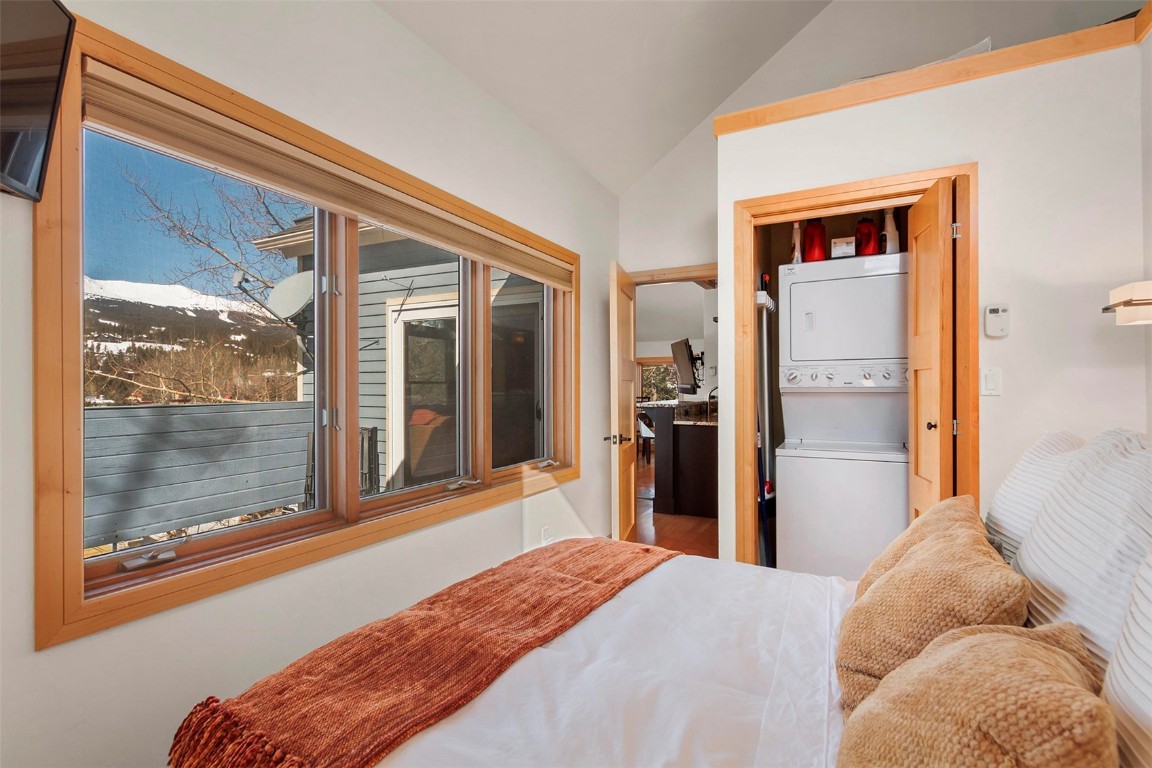 217 South Ridge Street, Unit 3 Breckenridge, CO 80424 - Photo 13 of 21 a bedroom with a bed and a large window with balcony view
