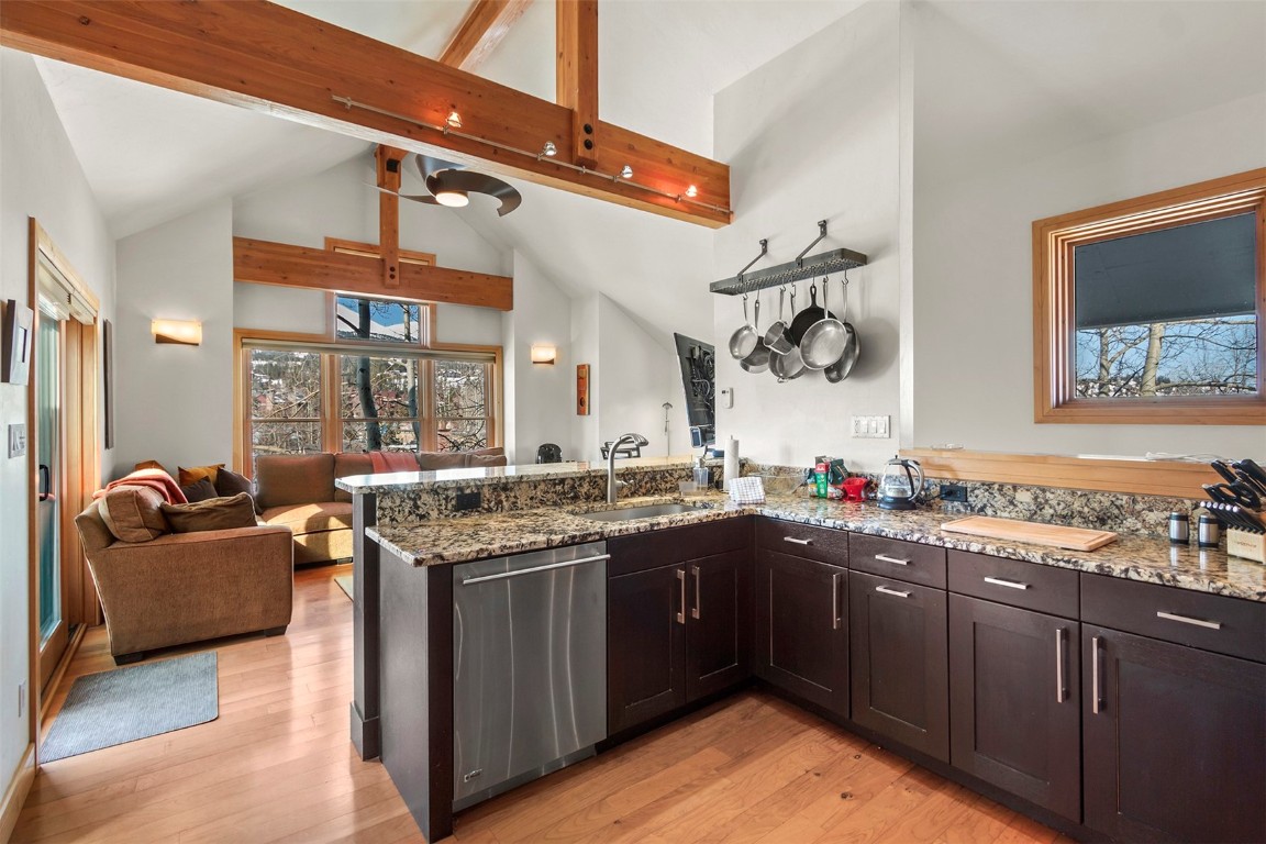 217 South Ridge Street, Unit 3 Breckenridge, CO 80424 - Photo 2 of 21 a kitchen with a stove sink and cabinets