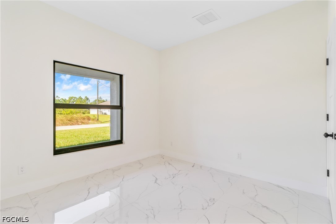 412 Fitch Avenue Lehigh Acres, FL 33972 - Photo 30 of 50 a view of a window in a room