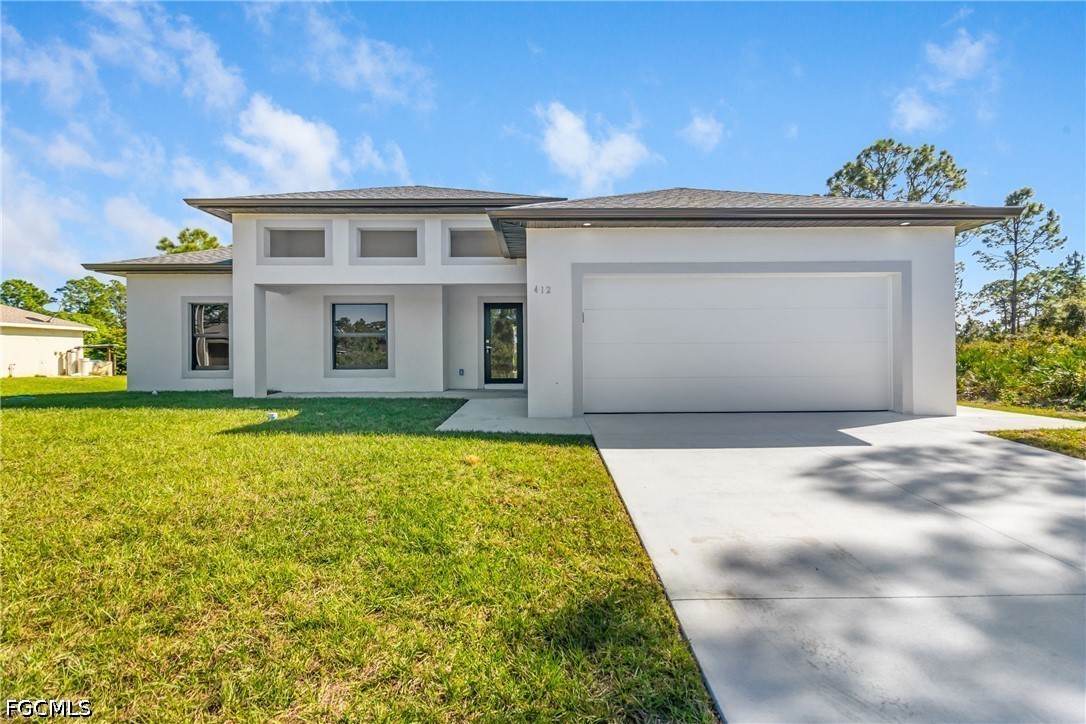 412 Fitch Avenue Lehigh Acres, FL 33972 - Photo 3 of 50 a view of front door and entertaining space