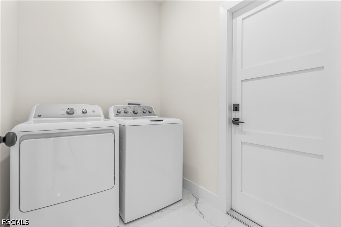 412 Fitch Avenue Lehigh Acres, FL 33972 - Photo 39 of 50 a utility room with dryer and washer