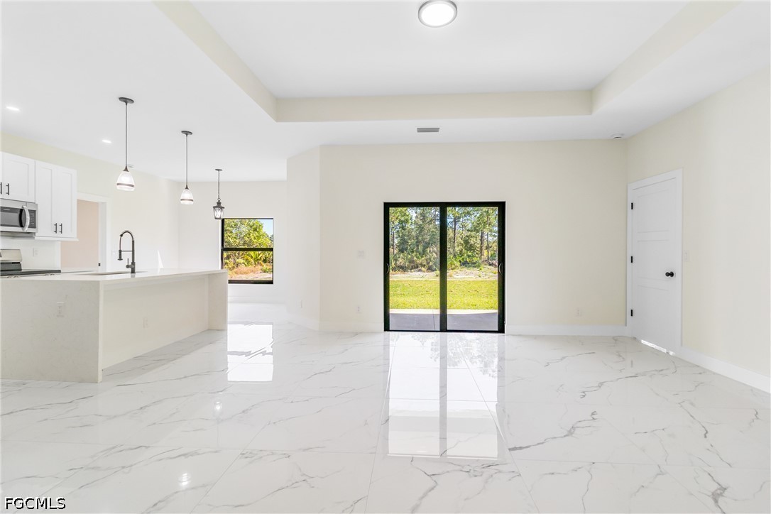 412 Fitch Avenue Lehigh Acres, FL 33972 - Photo 6 of 50 a view of an empty room with a window