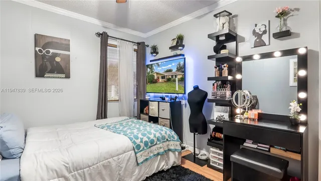 a bedroom with bed and a window