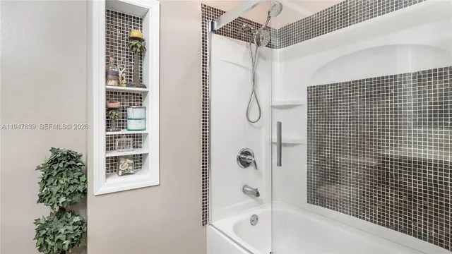 a bathroom with a shower and a bathtub