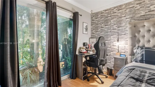 a room with furniture and floor to ceiling window