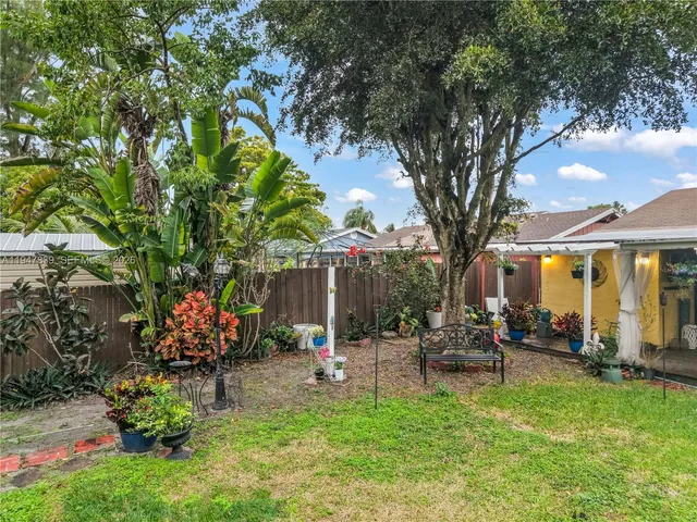 a view of a porch with potted plants