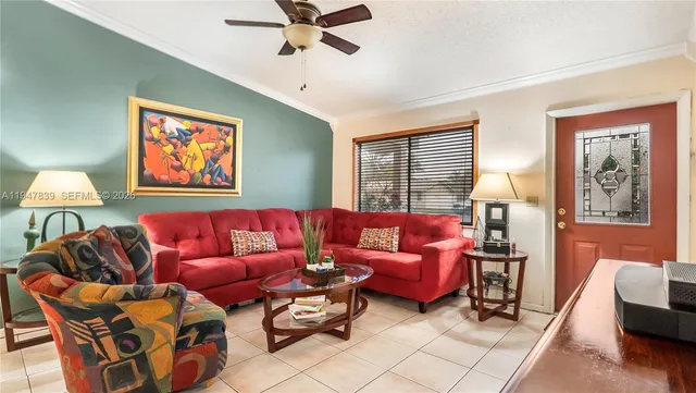 a living room with furniture and a window