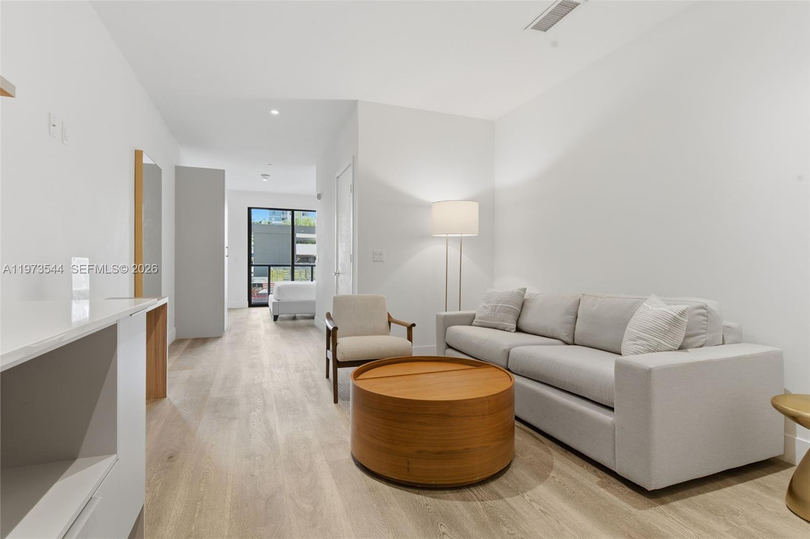 229 Southwest 9th Street, Unit 407 Miami, FL 33130 - Photo 15 of 29 a living room with furniture and a fireplace