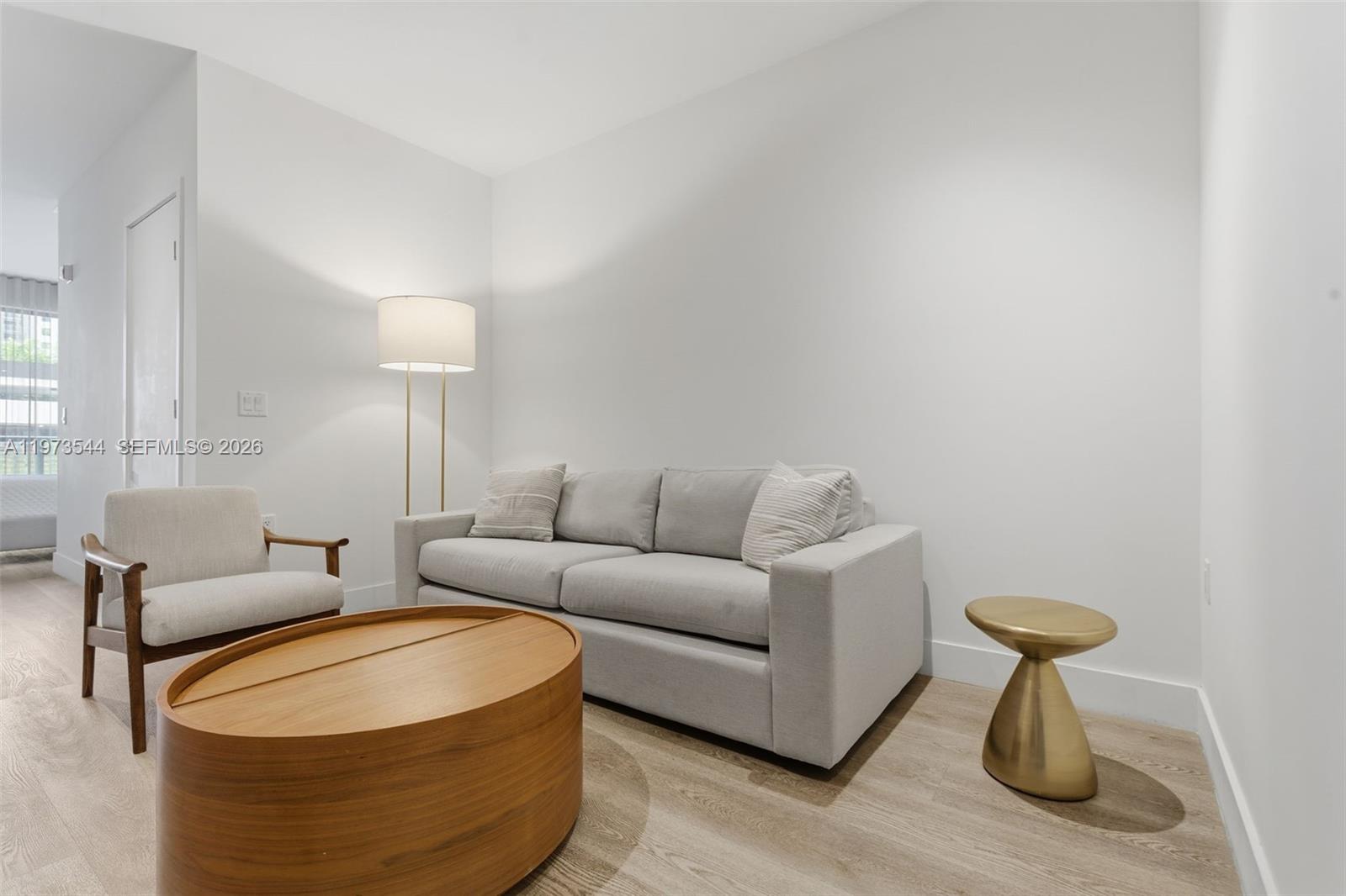 229 Southwest 9th Street, Unit 407 Miami, FL 33130 - Photo 18 of 29 a living room with furniture a lamp and a lamp