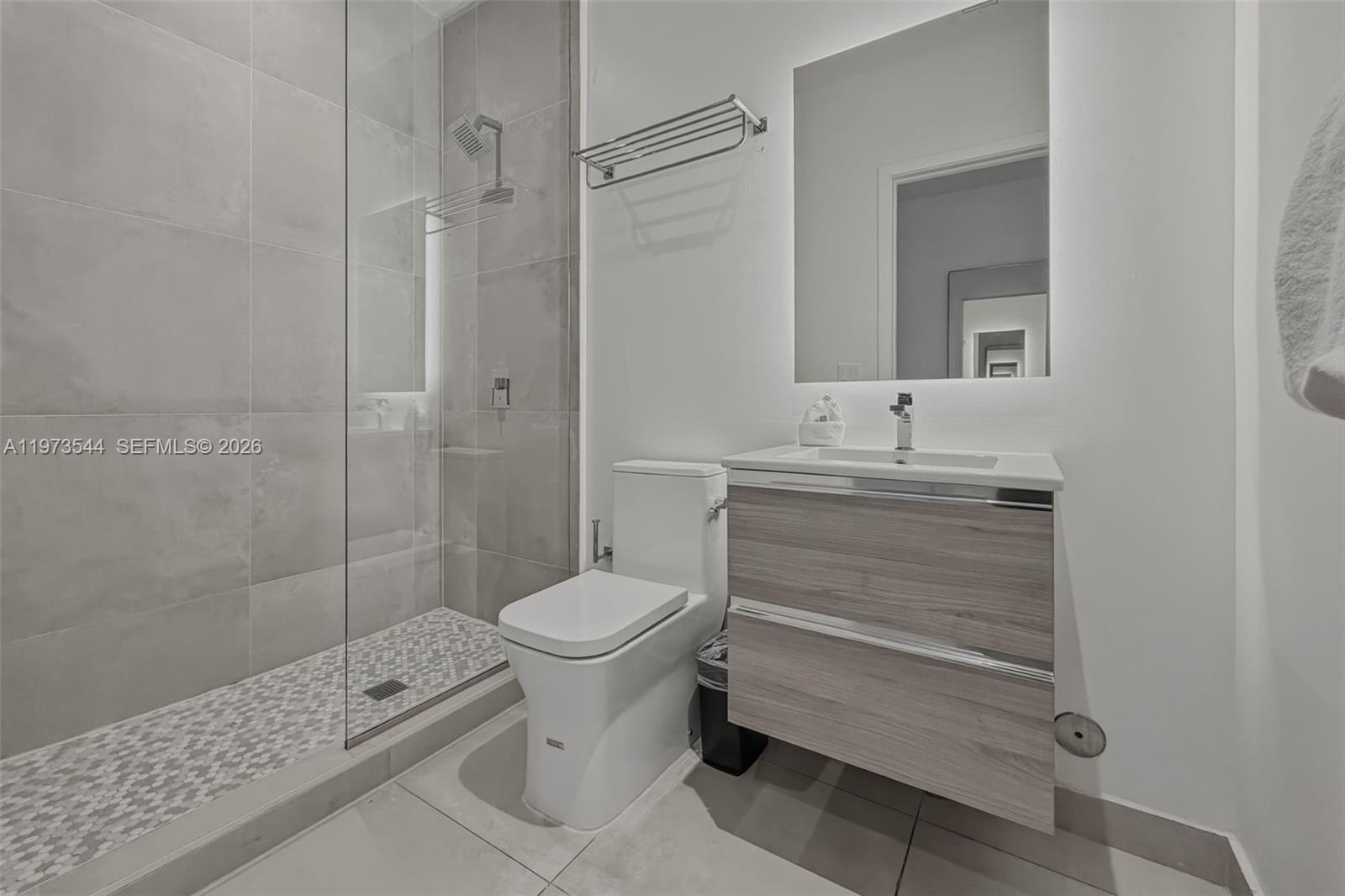 229 Southwest 9th Street, Unit 407 Miami, FL 33130 - Photo 22 of 29 a bathroom with a sink toilet and shower