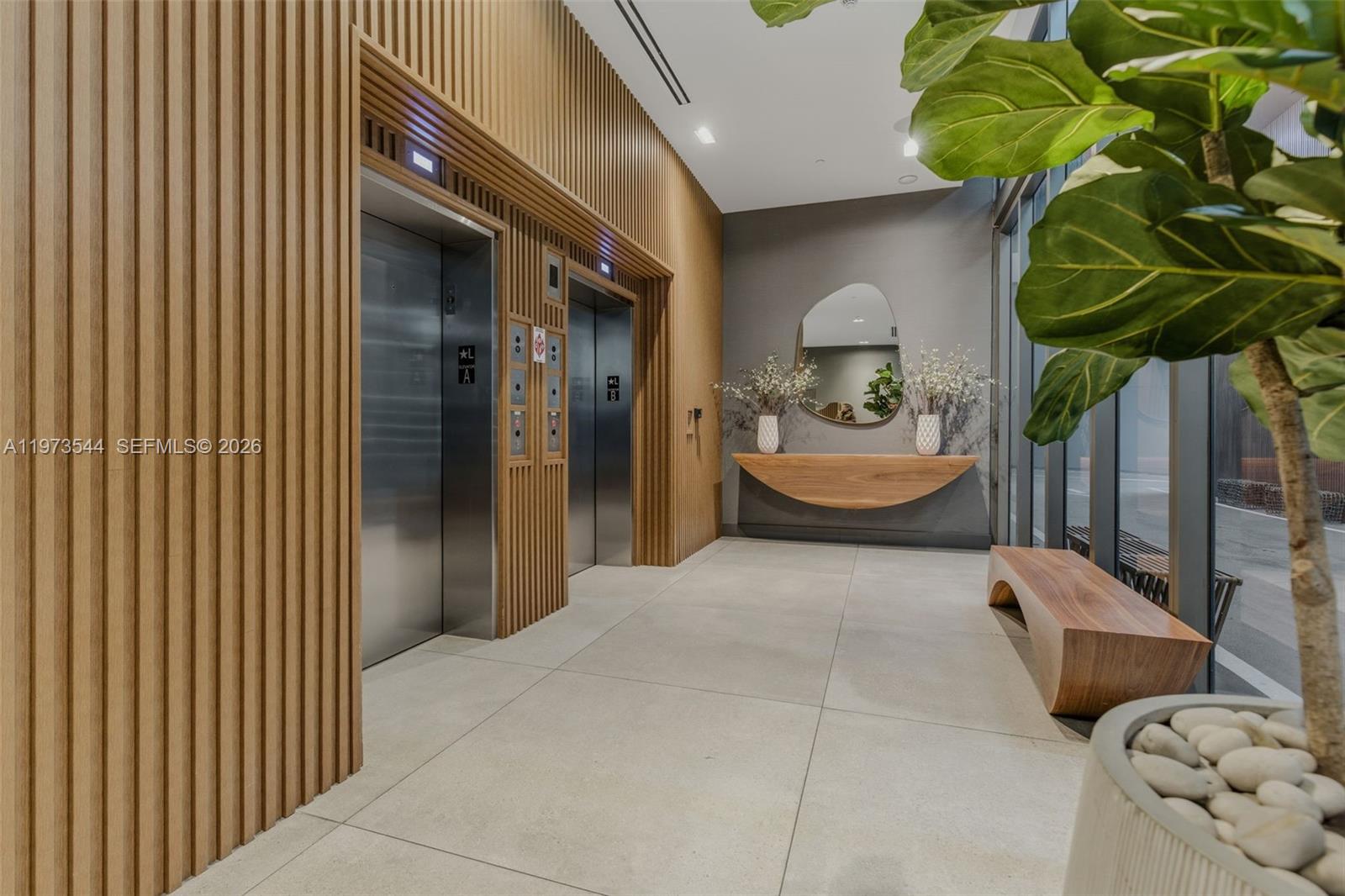 229 Southwest 9th Street, Unit 407 Miami, FL 33130 - Photo 10 of 29 a bedroom with a bed and a painting on the wall