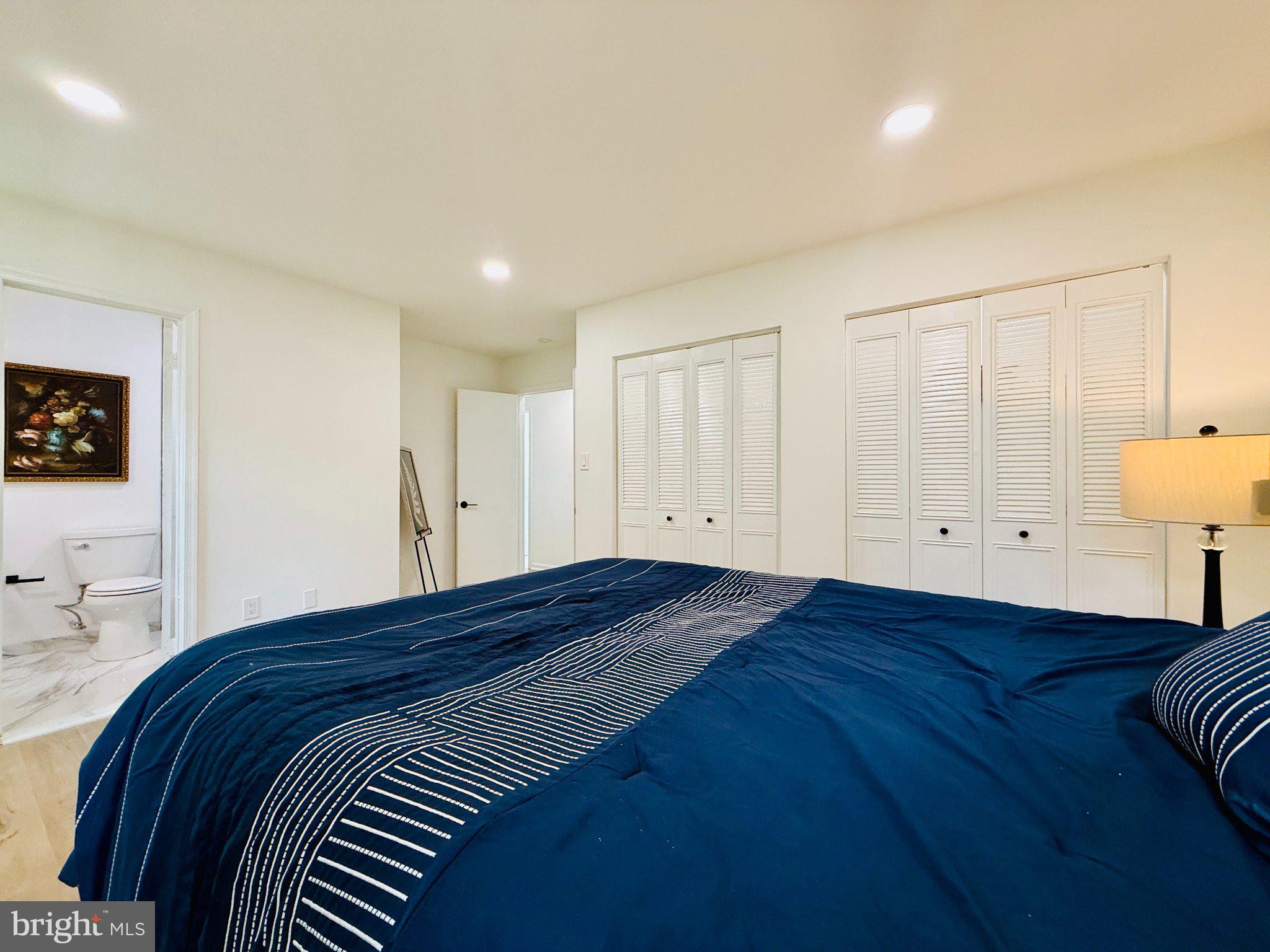 815 Whitehall Street Silver Spring, MD 20901 - Photo 18 of 39 Serene bedroom with modern elegance.