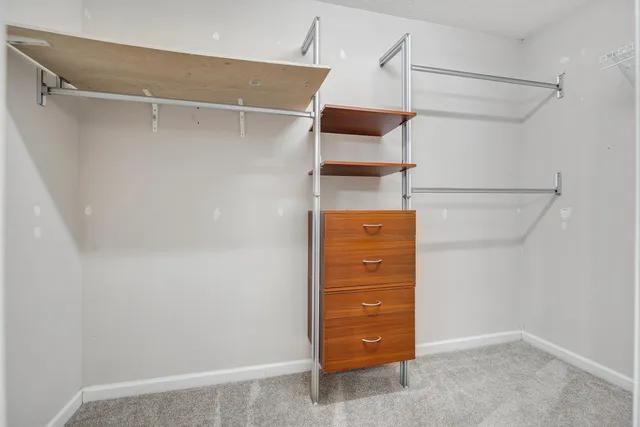 a view of an empty walk in closet