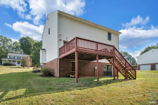 a balcony with wooden floor and fence
