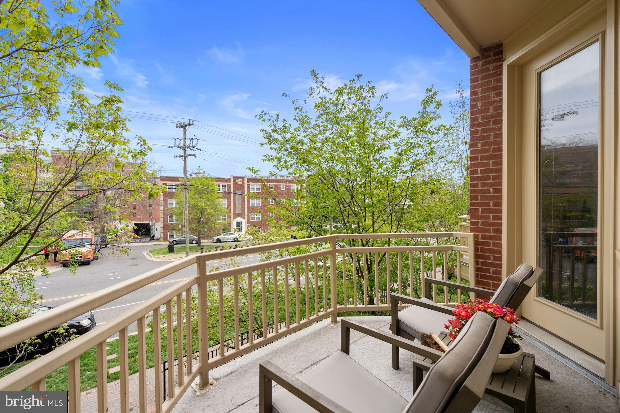 1618 North Rhodes Street Arlington, VA 22209 - Photo 15 of 33 a view of a balcony with chair and wooden floor