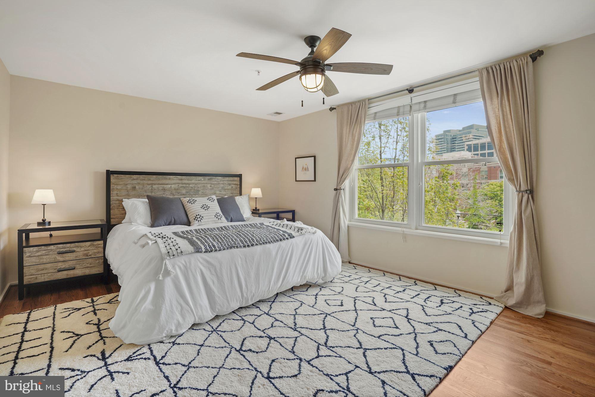 1618 North Rhodes Street Arlington, VA 22209 - Photo 16 of 33 a bedroom with a bed and window