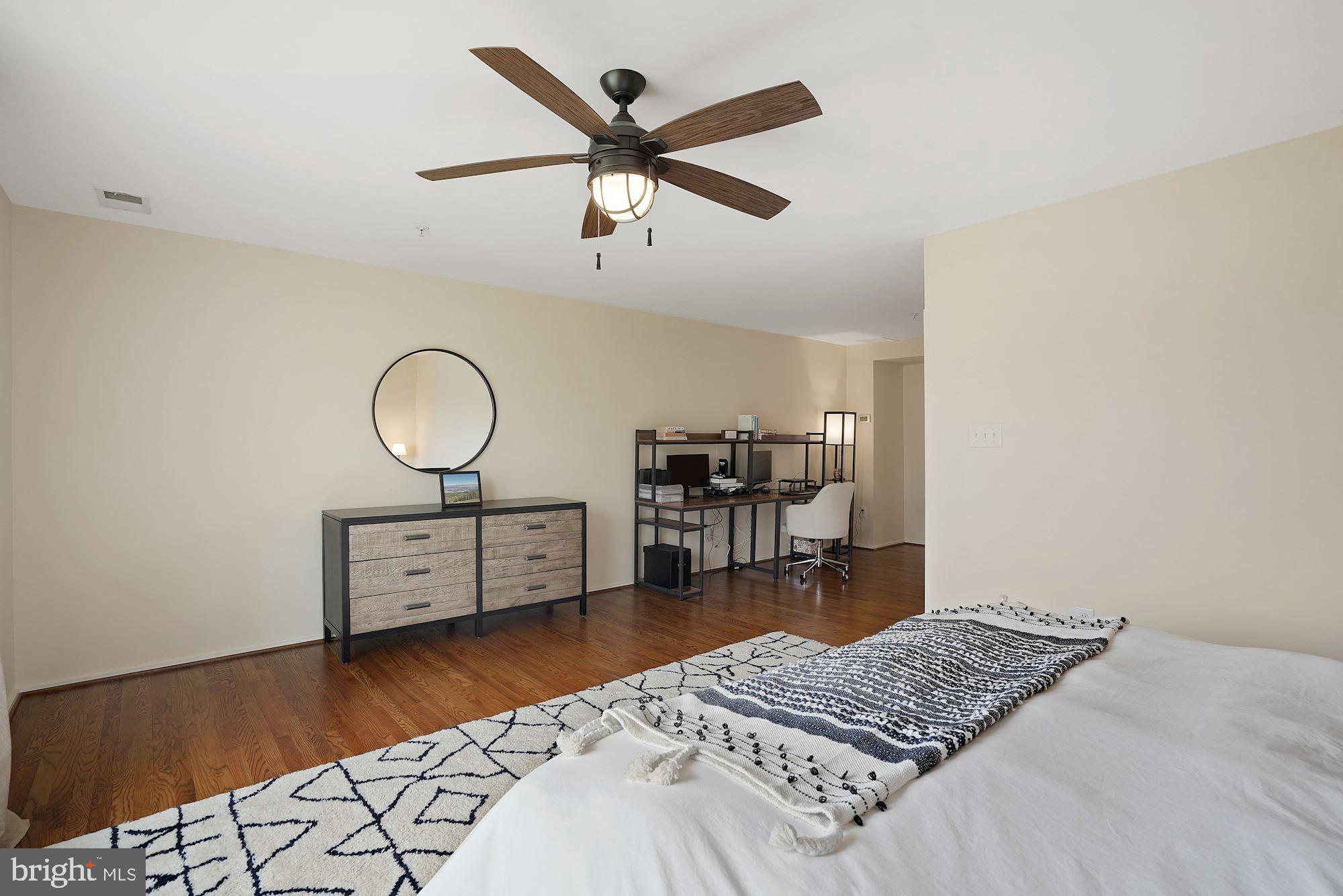 1618 North Rhodes Street Arlington, VA 22209 - Photo 18 of 33 a living room with couch and a wooden floor