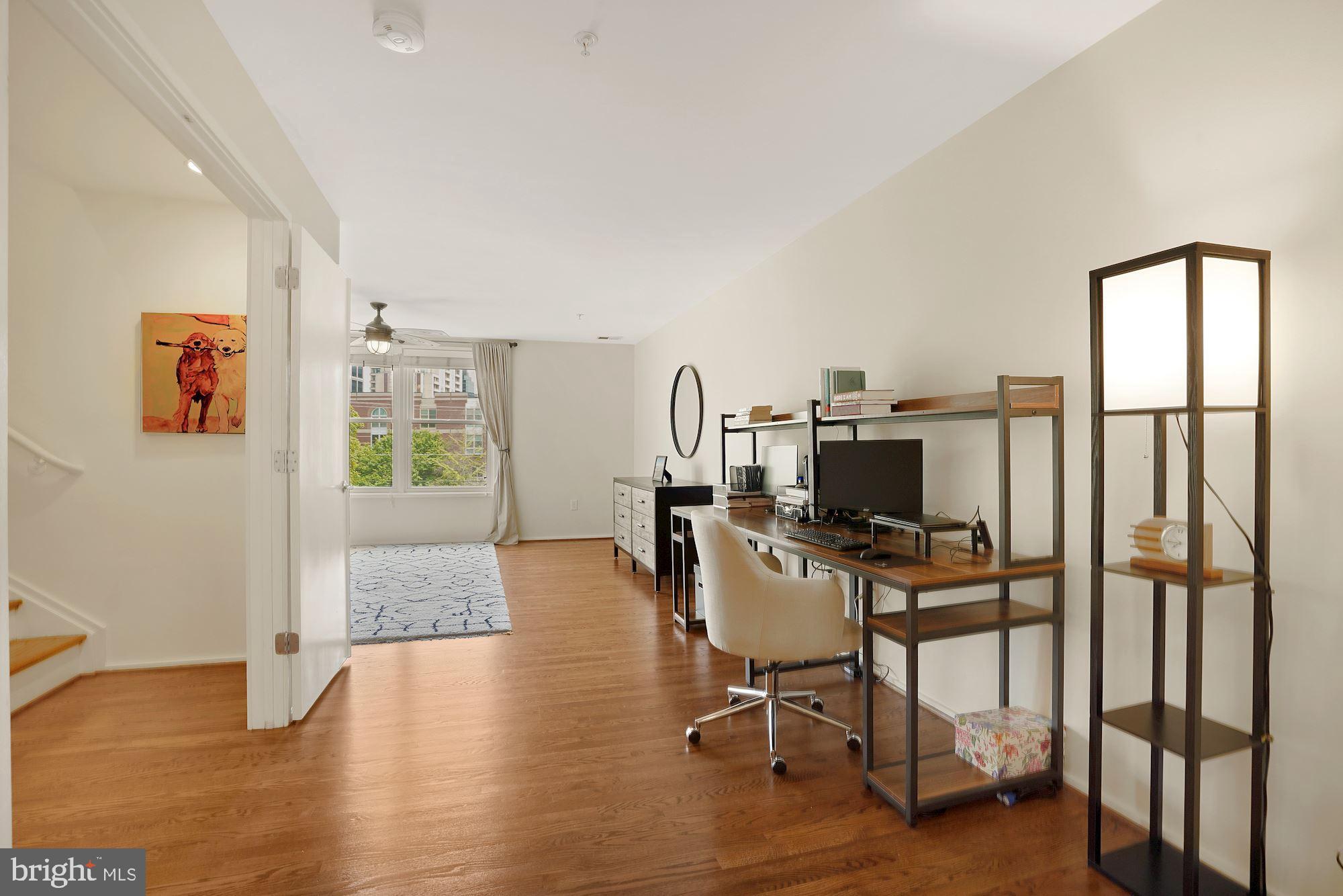 1618 North Rhodes Street Arlington, VA 22209 - Photo 19 of 33 a view of a workspace with furniture and a window
