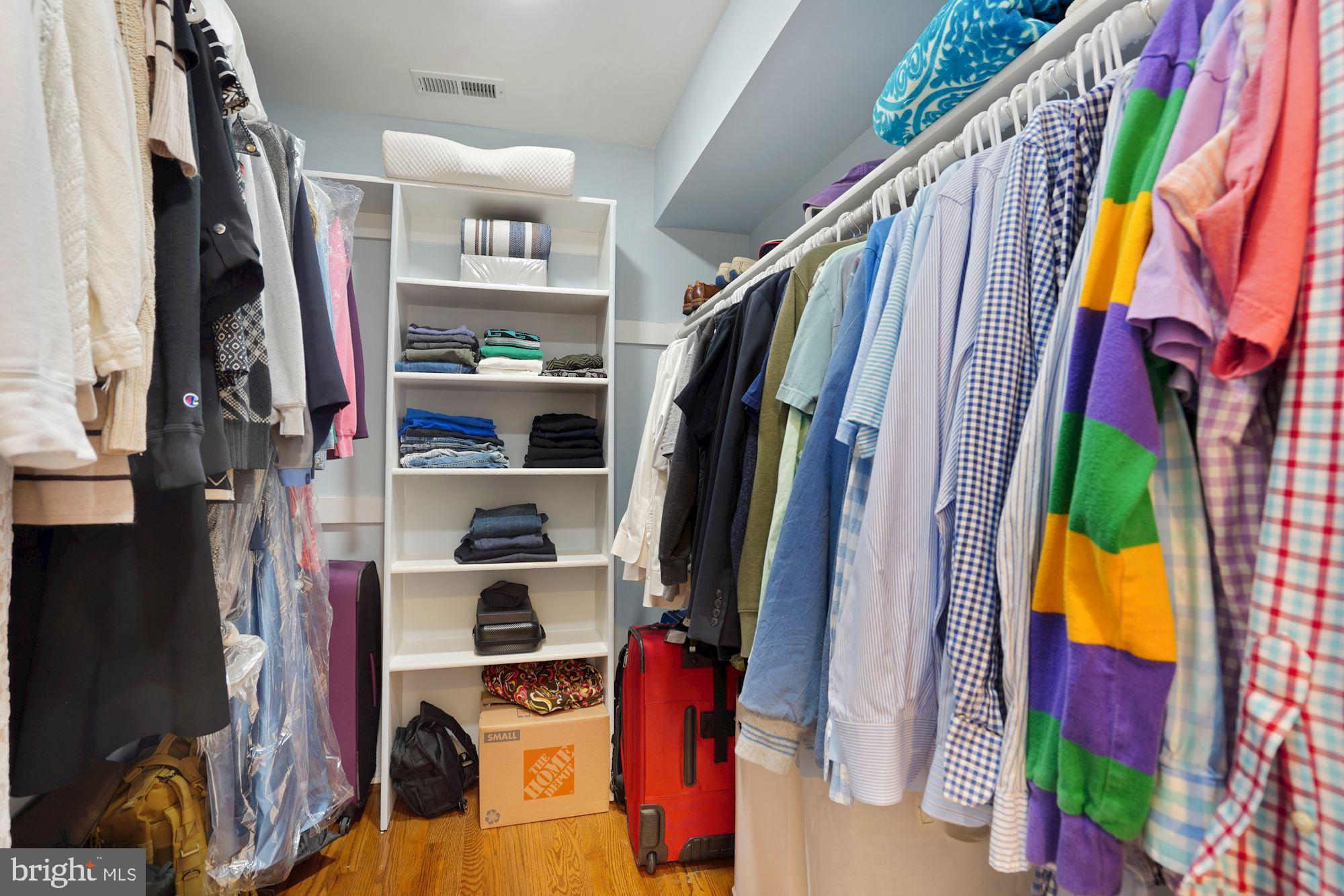 1618 North Rhodes Street Arlington, VA 22209 - Photo 22 of 33 a view of walk in closet with clothes and shoes