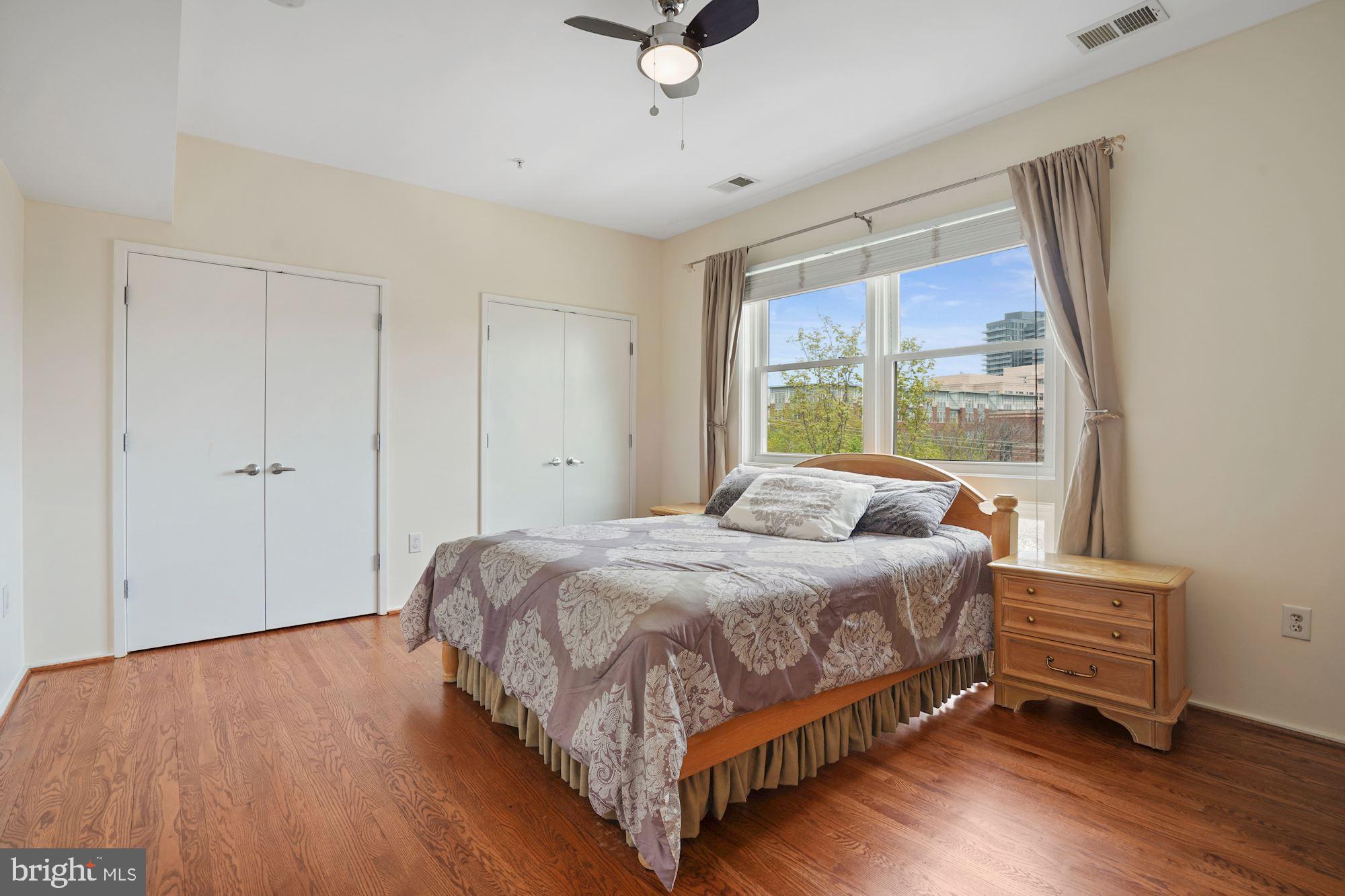 1618 North Rhodes Street Arlington, VA 22209 - Photo 25 of 33 a bedroom with a bed and a window