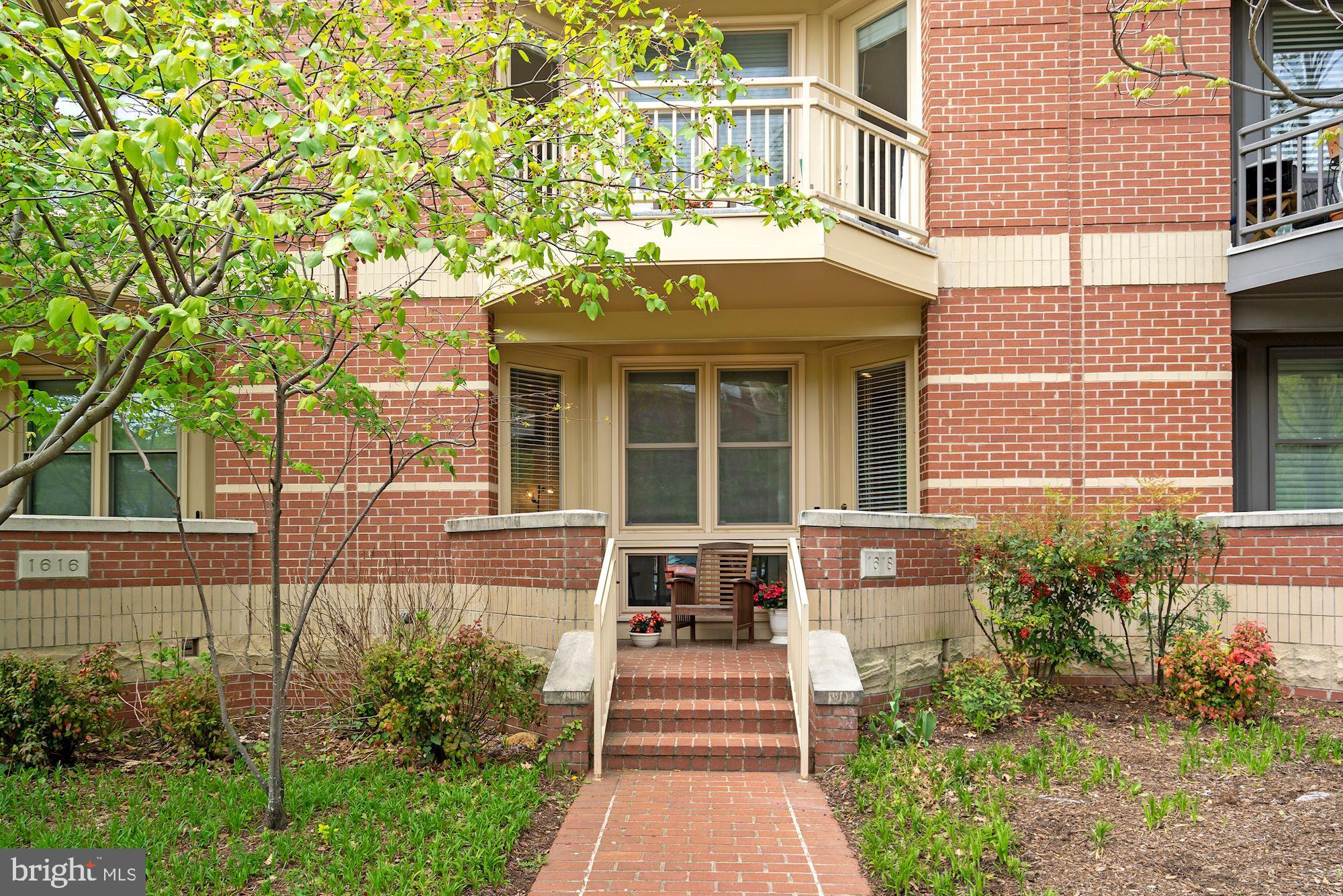 1618 North Rhodes Street Arlington, VA 22209 - Photo 33 of 33 a front view of a house with a garden